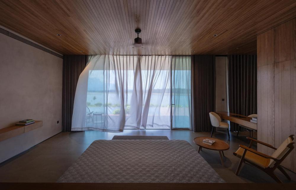 ไอเดียแบบบ้านพักตากอากาศสไตล์โมเดิร์นทรงกล่อง ออกแบบให้ลมเข้าออกถ่ายเทริมน้ำ รูปที่ 9