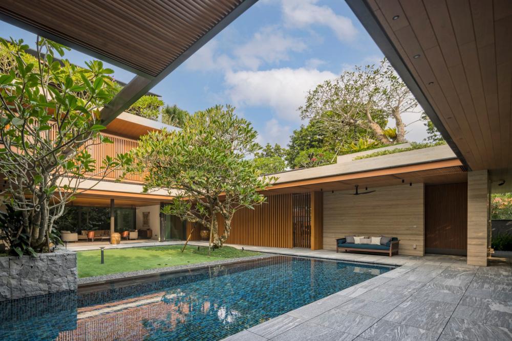 บ้านโมเดิร์นทรงกล่องผสานไม้และลายไม้ โดยสถาปนิกต่างชาติ รูปที่ 10